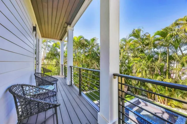 a view of balcony with furniture and wooden deck