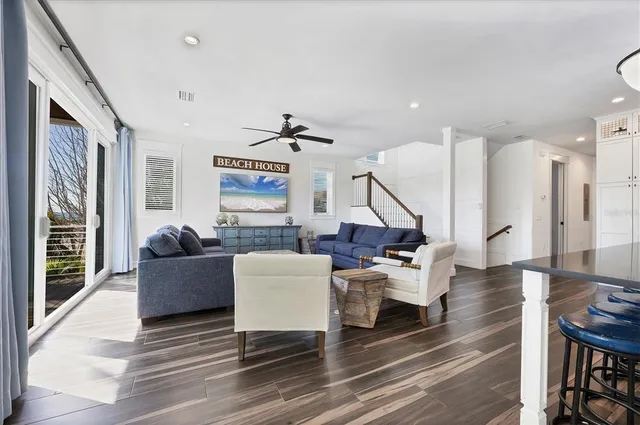 a living room with fireplace furniture and a wooden floor