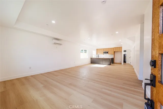 a bedroom with a bed and mirror