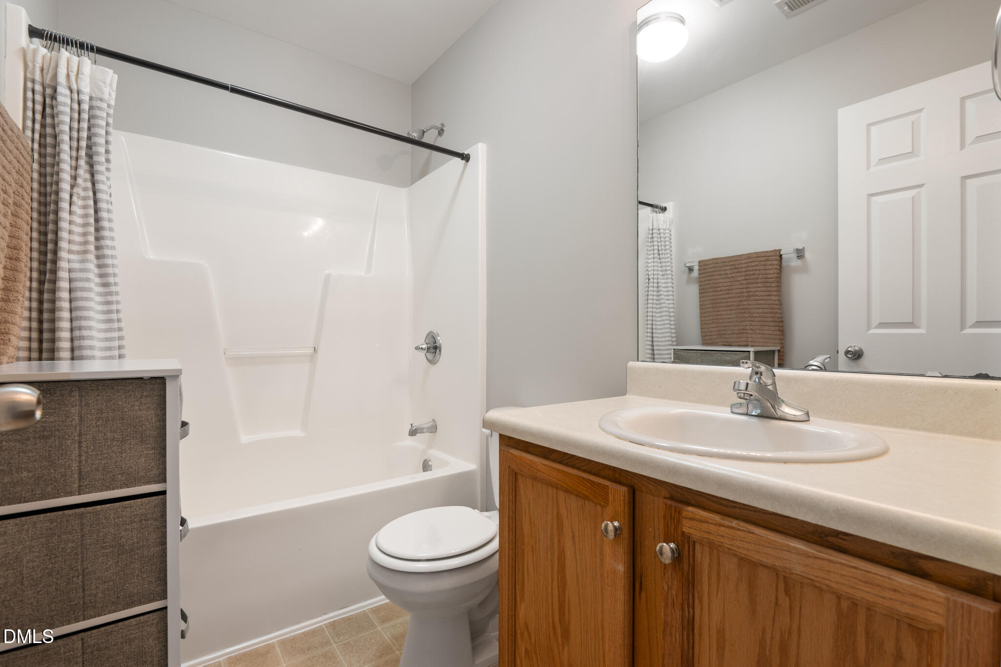2019 Tennessee Road Durham, NC 27704 - Photo 26 of 28 a bathroom with a sink toilet and shower
