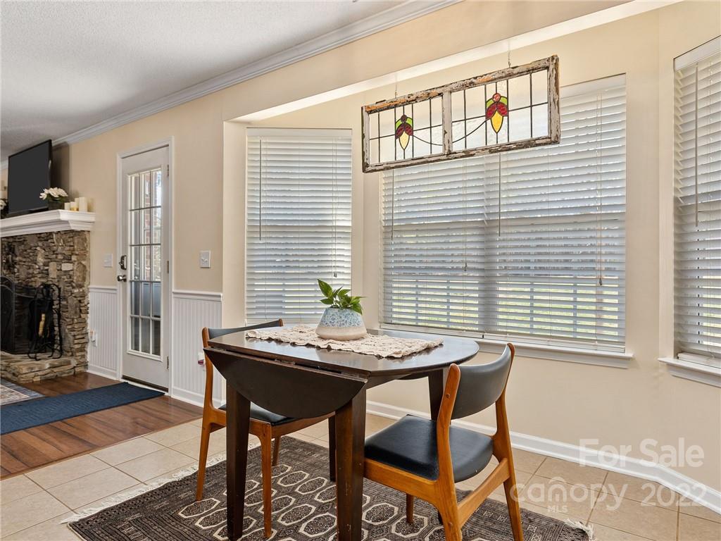 1085 Hooper Creek Road Tryon, NC 28782 - Photo 13 of 34 a dining room with furniture and wooden floor