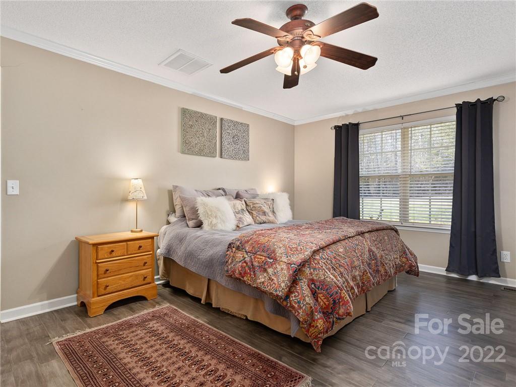 1085 Hooper Creek Road Tryon, NC 28782 - Photo 18 of 34 a bedroom with a bed and a window