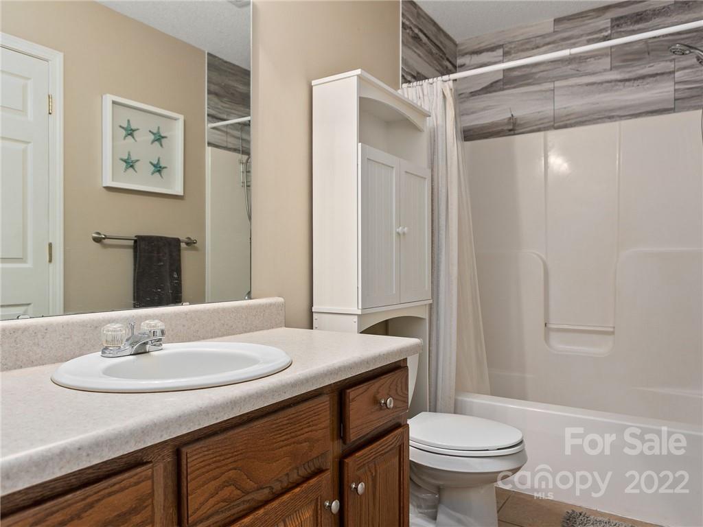 1085 Hooper Creek Road Tryon, NC 28782 - Photo 24 of 34 a bathroom with a sink and a mirror