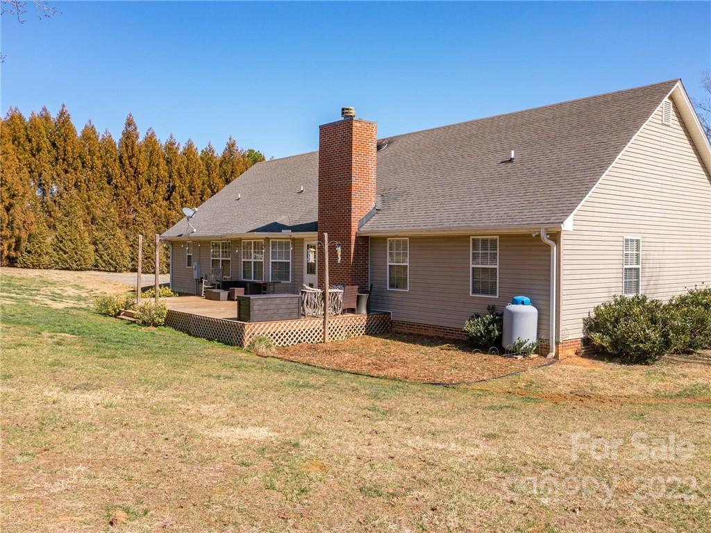 1085 Hooper Creek Road Tryon, NC 28782 - Photo 29 of 34 a house view with a sitting space and garden