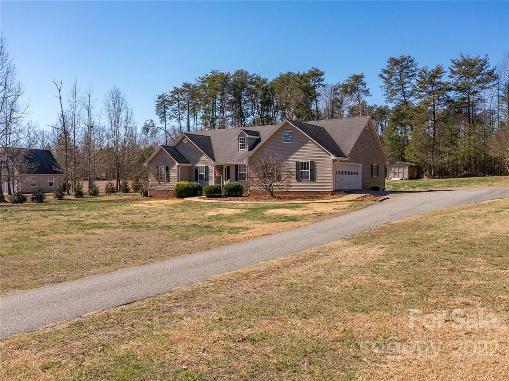 1085 Hooper Creek Road Tryon, NC 28782 - Photo 3 of 34 a view of a house with a yard