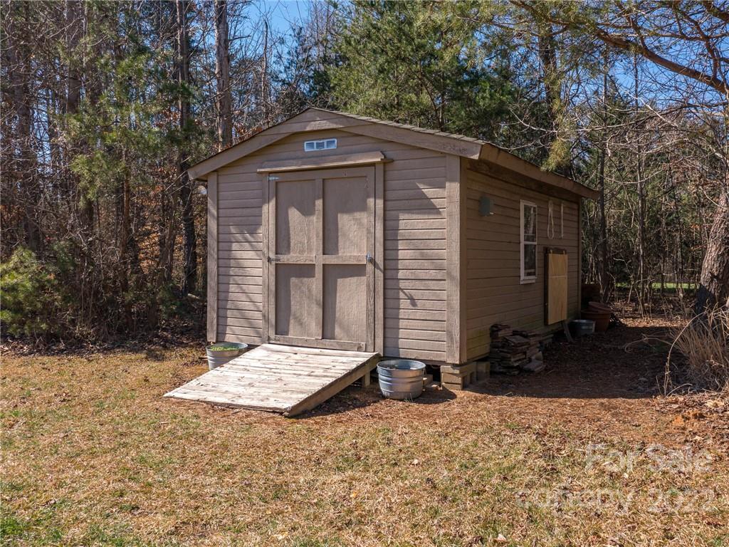 1085 Hooper Creek Road Tryon, NC 28782 - Photo 32 of 34 a front view of a house with a yard