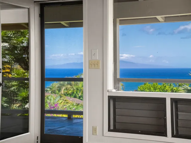 a view of a door and a window