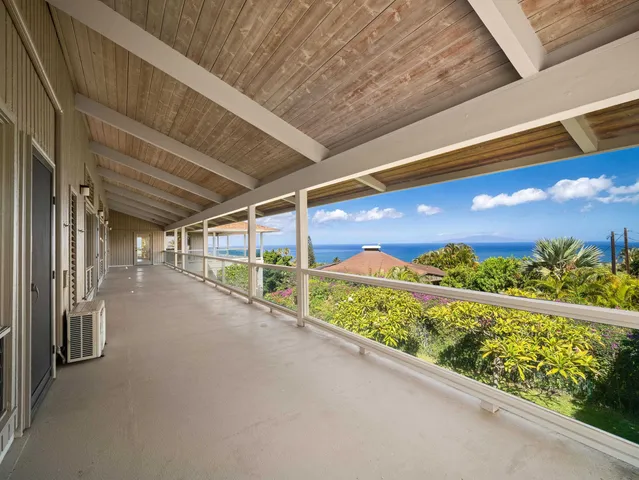 a view of an empty room with a balcony