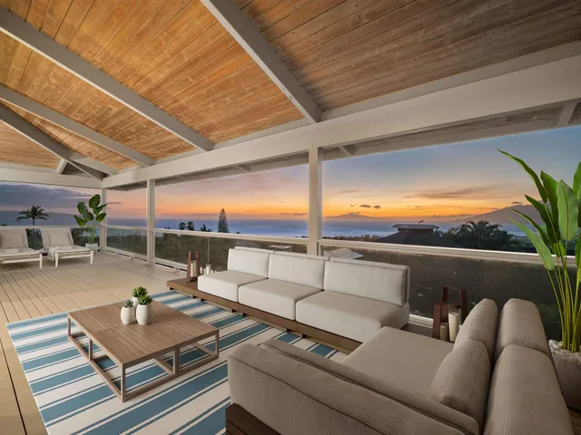 a view of sitting area with furniture and city view