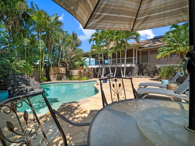 a view of swimming pool with a patio