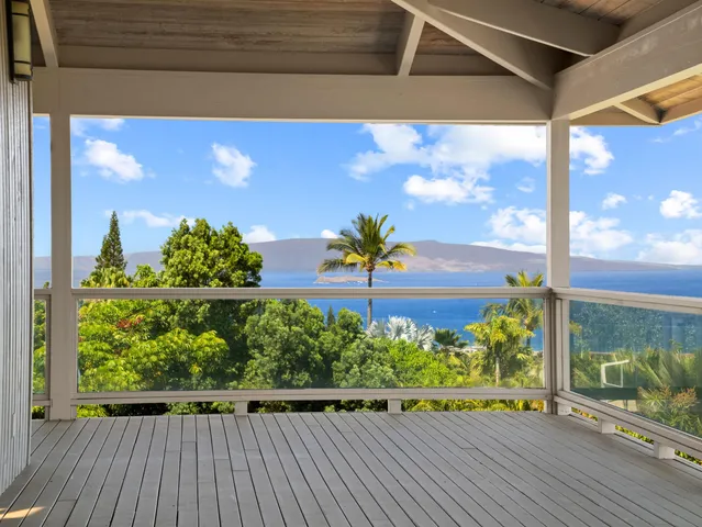 a view of balcony with wooden floor
