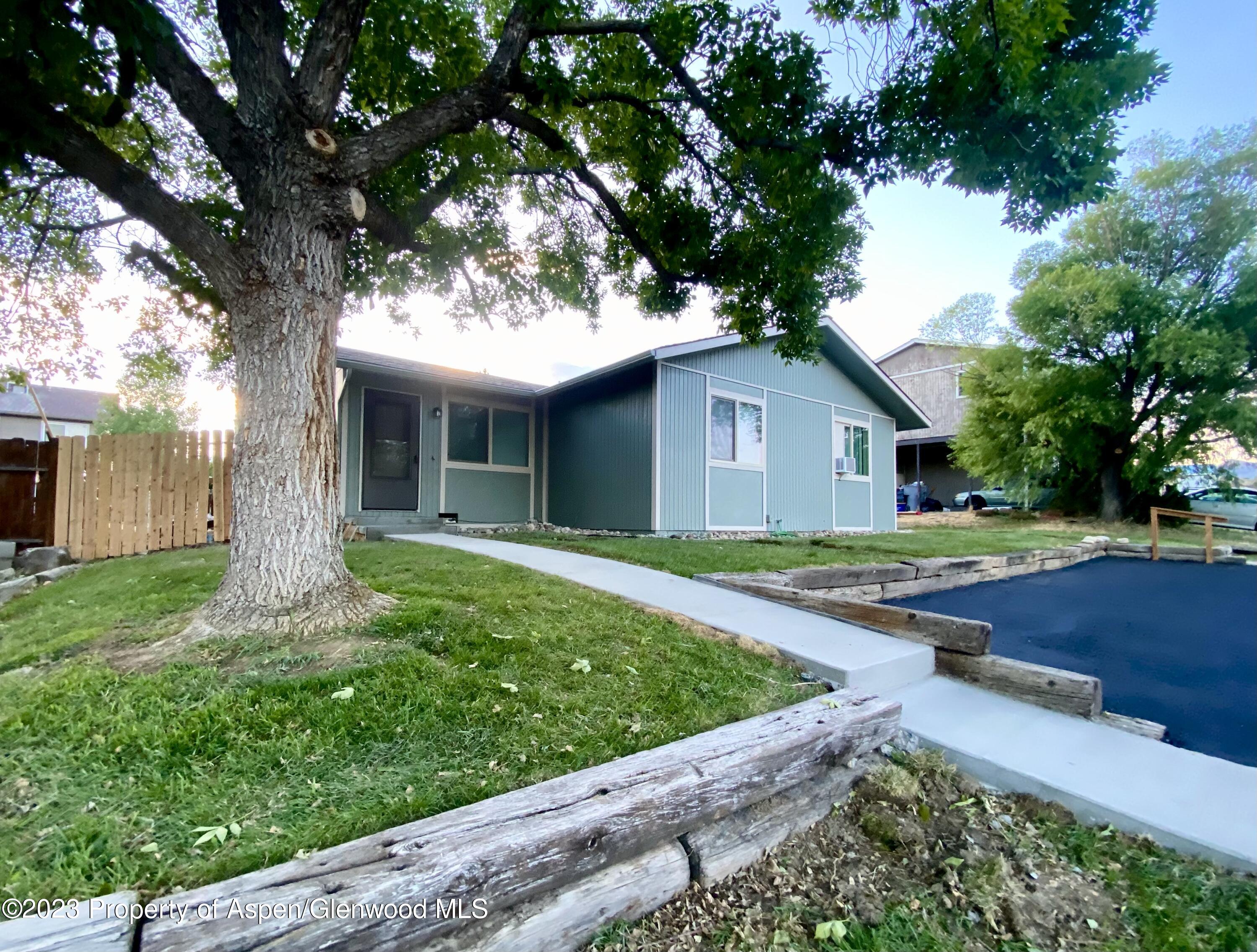 2415 West Avenue Rifle, CO 81650 - Photo 2 of 9 a front view of house with yard and green space