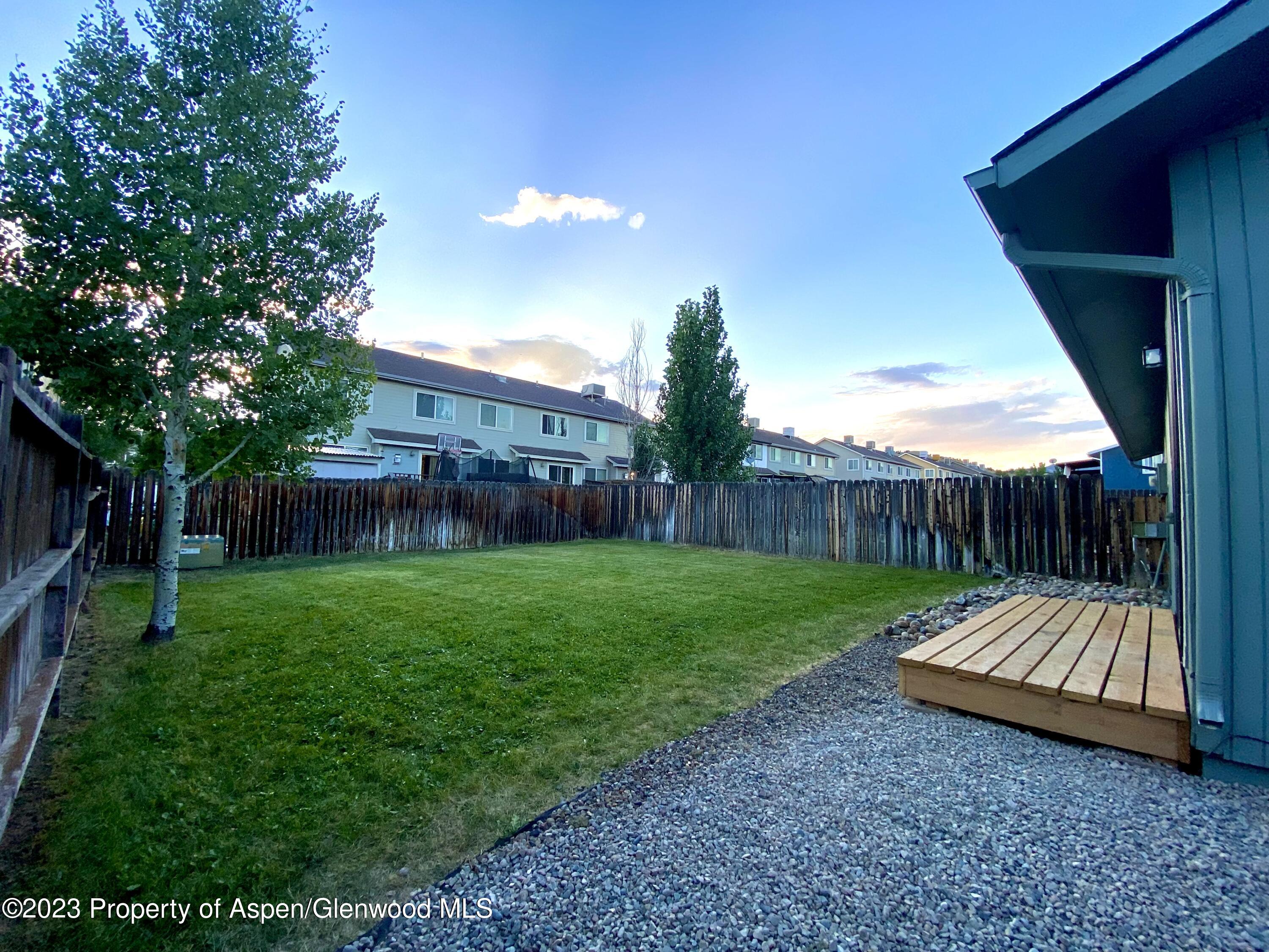 2415 West Avenue Rifle, CO 81650 - Photo 3 of 9 a view of a backyard with a garden