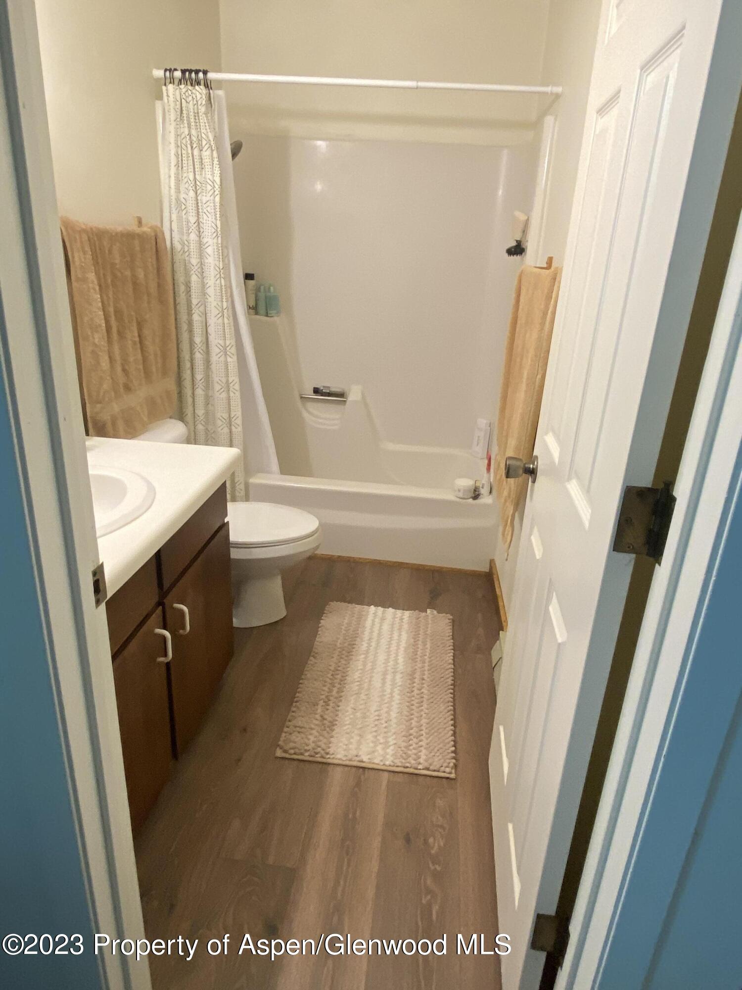 2415 West Avenue Rifle, CO 81650 - Photo 9 of 9 a bathroom with a tub a sink and a shower