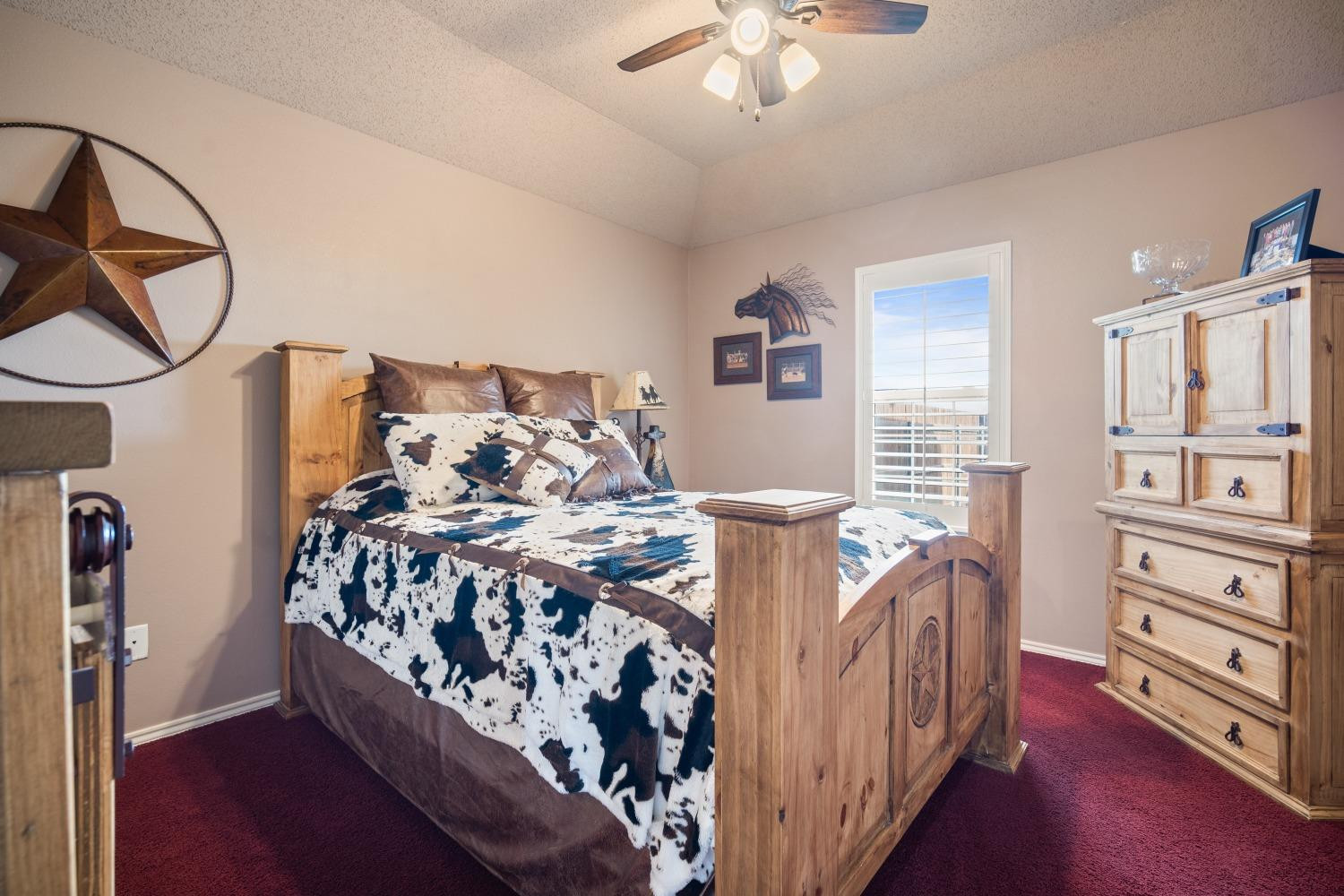 6487 East Fm 41 Ropesville, TX 79358 - Photo 14 of 33 a bed room with a bed and a chandelier