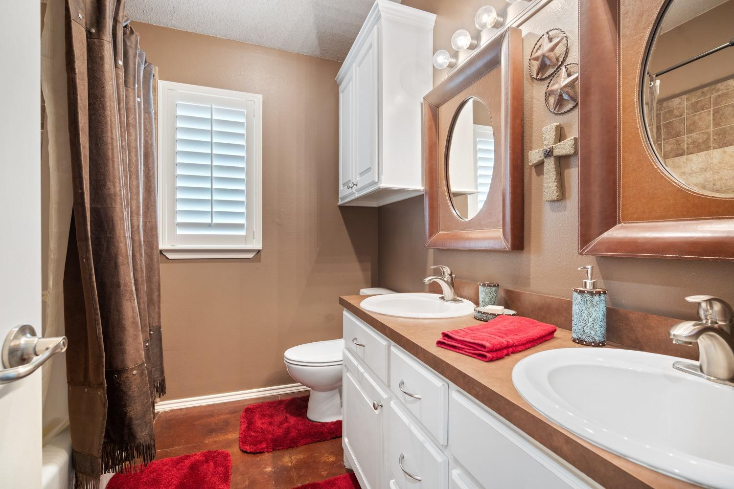 6487 East Fm 41 Ropesville, TX 79358 - Photo 16 of 33 a bathroom with a granite countertop toilet sink and mirror