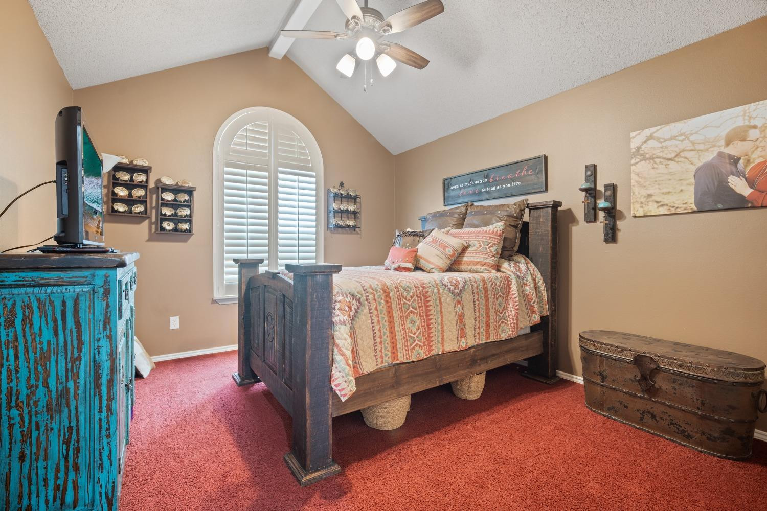 6487 East Fm 41 Ropesville, TX 79358 - Photo 17 of 33 a bedroom with a bed and a chandelier