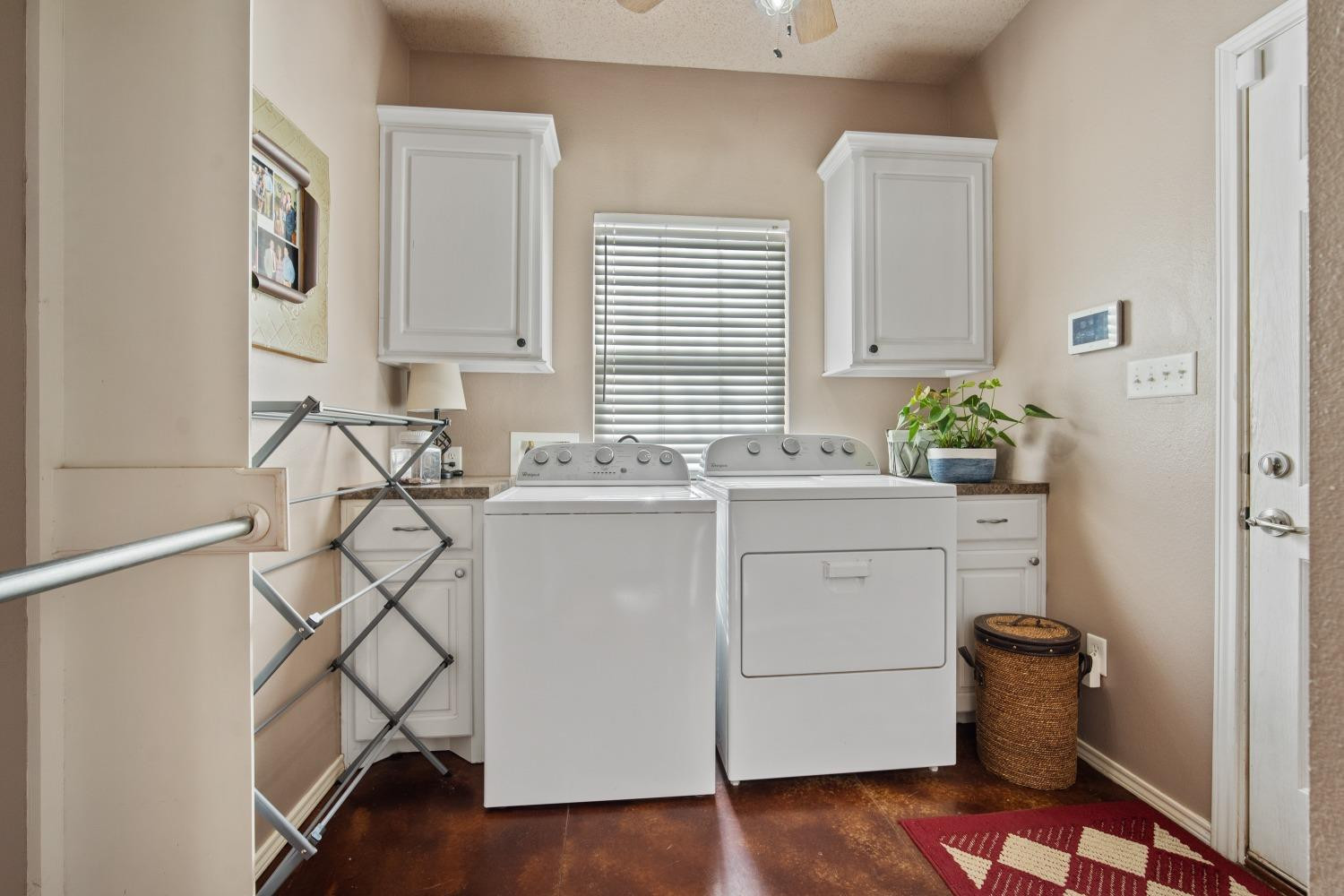 6487 East Fm 41 Ropesville, TX 79358 - Photo 24 of 33 a utility room with cabinets washer and dryer
