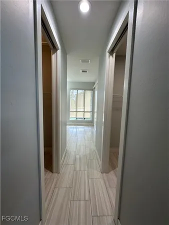 a view of empty room with a fireplace