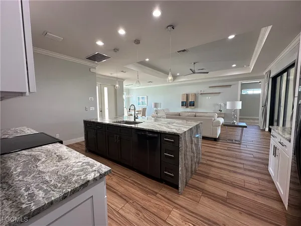 a view of kitchen with furniture and wooden floor