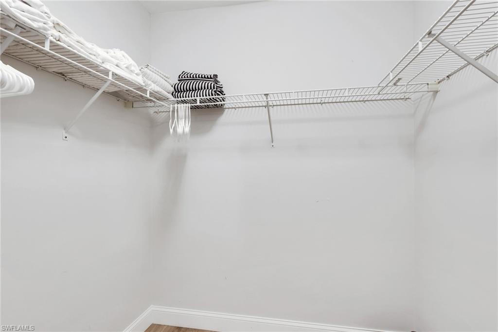 7766 Emerald Circle, Unit R203 Naples, FL 34109 - Photo 17 of 25 a view of walk in closet