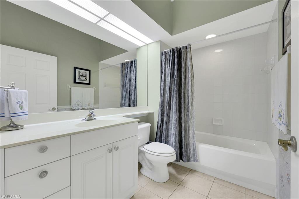 10751 Halfmoon Shoal Road, Unit 201 Estero, FL 34135 - Photo 19 of 47 Guest bathroom with bathtub and shower.