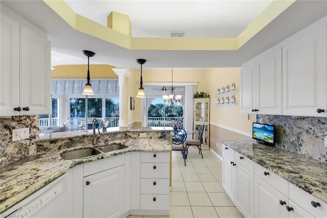 a kitchen with sink cabinets and window
