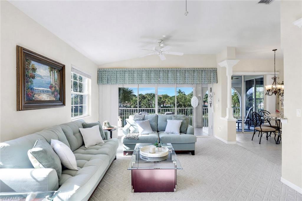 10751 Halfmoon Shoal Road, Unit 201 Estero, FL 34135 - Photo 6 of 47 (Virtual wall color change) Spacious living room with lots of natural light, carpeted flooring and beautiful view from the 2nd story overlooking the lake.