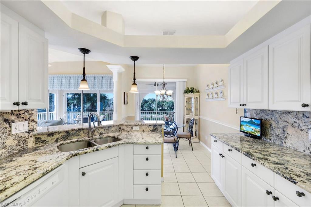 10751 Halfmoon Shoal Road, Unit 201 Estero, FL 34135 - Photo 10 of 47 (Virtual wall color change) Large kitchen with granite countertops, bar seating, plenty of cabinetry for storage and large pantry.