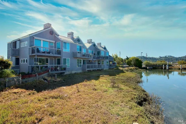 a front view of a house with a lake view