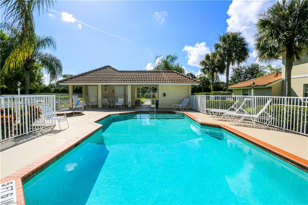 8175 Celeste Drive, Unit 1230 Naples, FL 34113 - Photo 33 of 35 a view of a house with swimming pool and sitting area