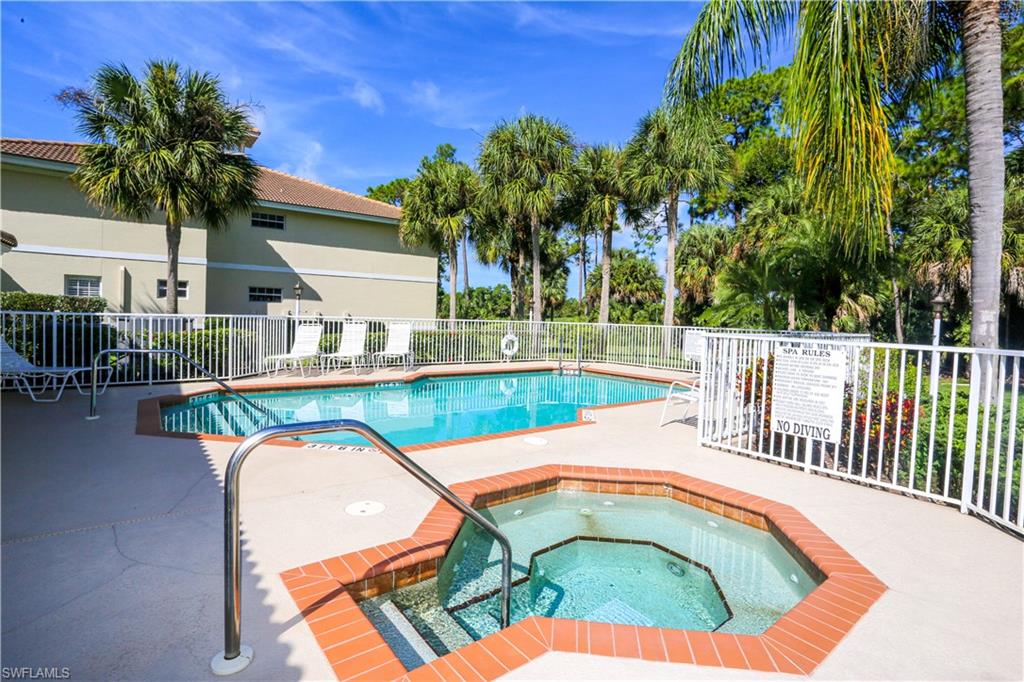 8175 Celeste Drive, Unit 1230 Naples, FL 34113 - Photo 34 of 35 a view of a swimming pool with a patio