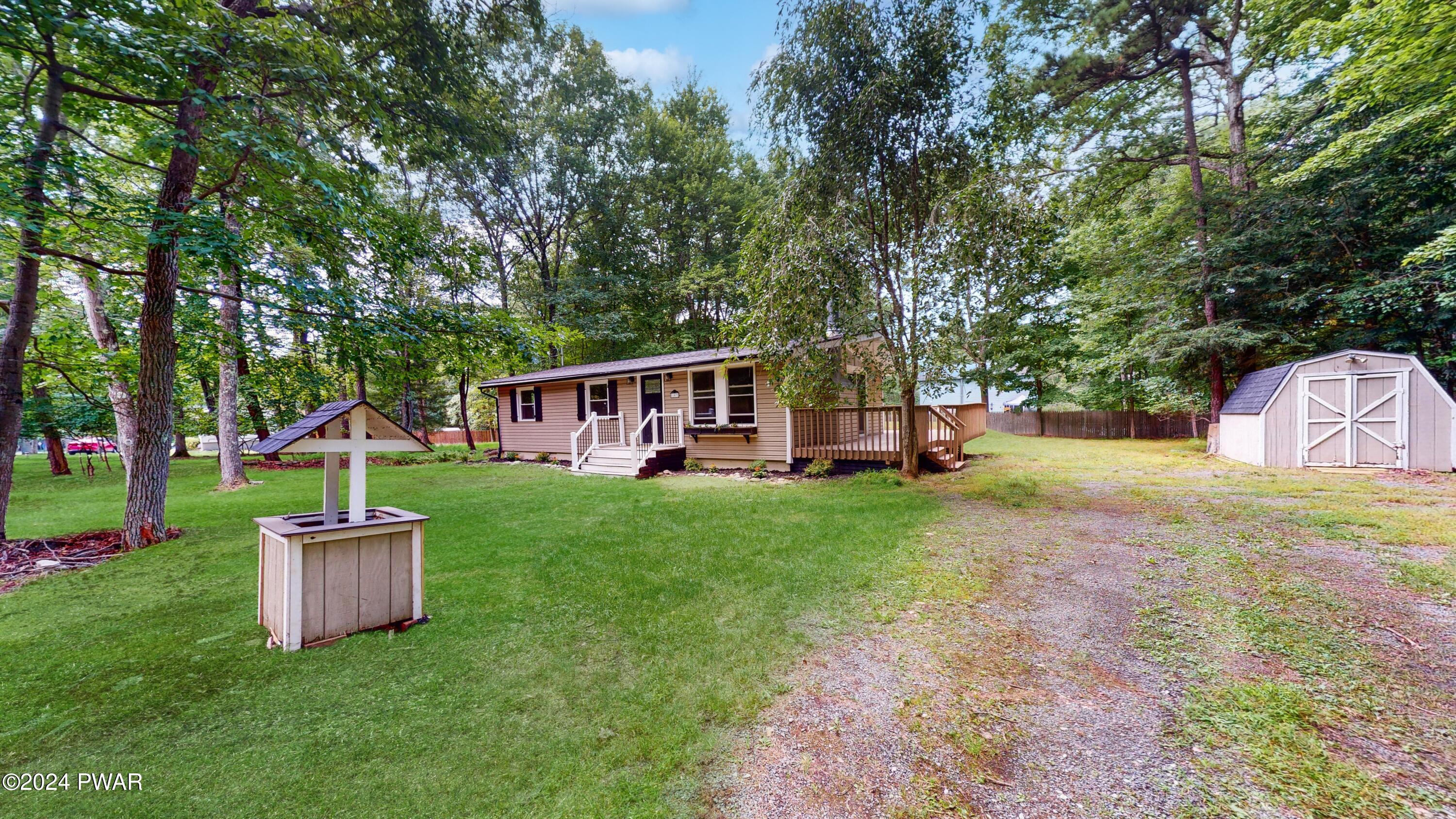 107 Hickory Road Milford, PA 18337 - Photo 13 of 39 a view of a house with backyard and a tree