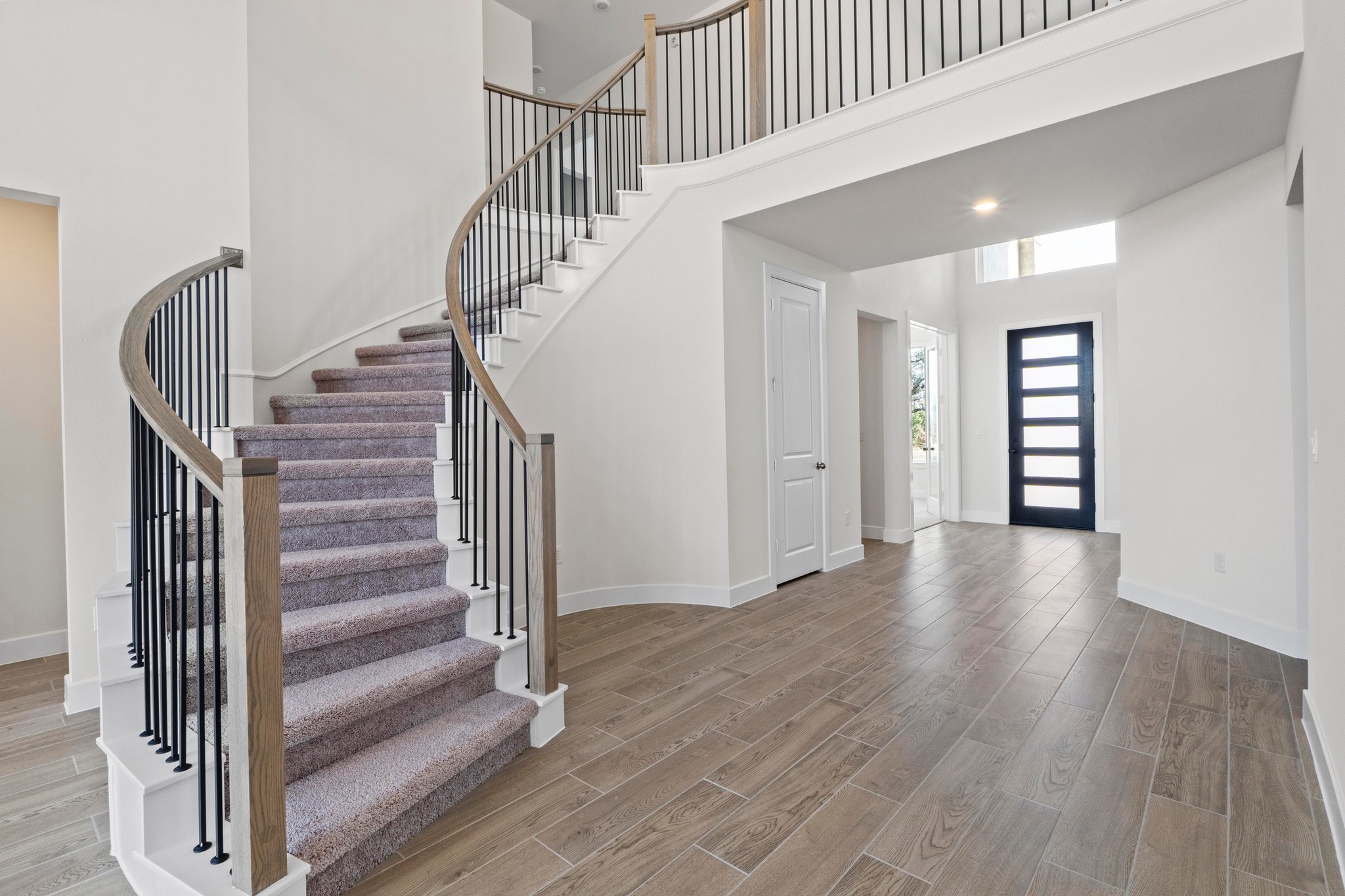 604 Lightstone Drive Georgetown, TX 78633 - Photo 18 of 39 a view of entryway with stairs and wooden floor