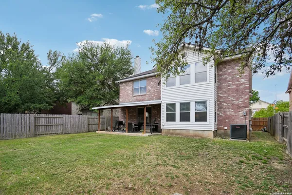 a view of a house with a yard porch and sitting area