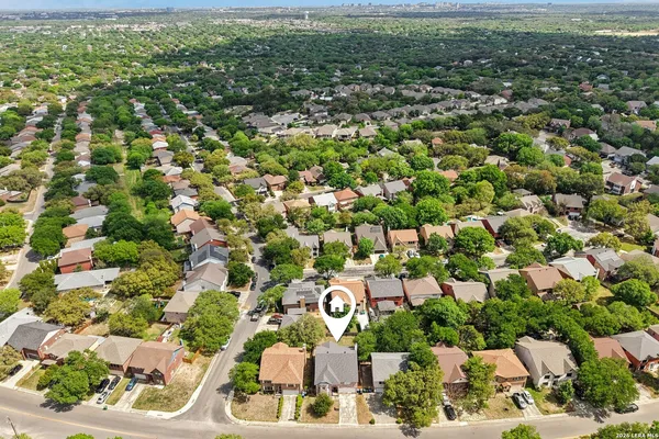 aerial view of a house with a yard