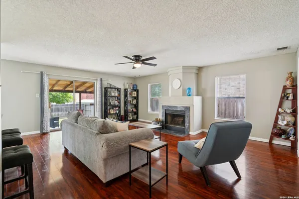 a living room with furniture and a fireplace