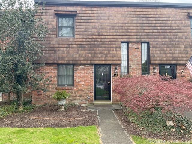 85 River Road, Unit L5 Essex, CT 06426 - Photo 1 of 1 a front view of a house with garden