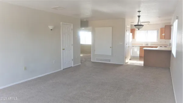 a view of a kitchen with a sink and dishwasher cabinets