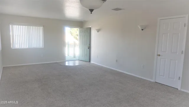 a view of empty room with windows