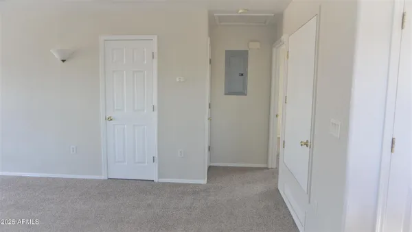 a view of a hallway with closet area