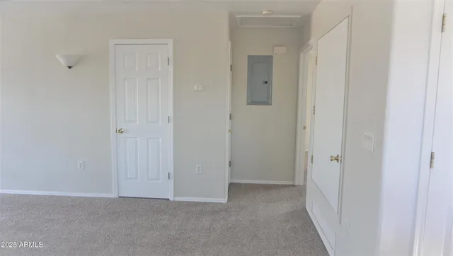 a view of a hallway with closet area