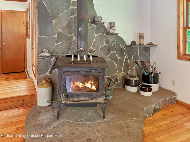 a view of a livingroom with furniture and a fireplace