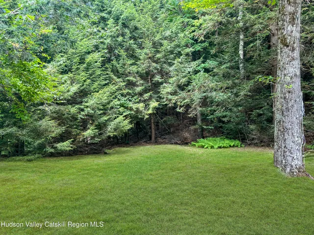 a view of front of house with a yard