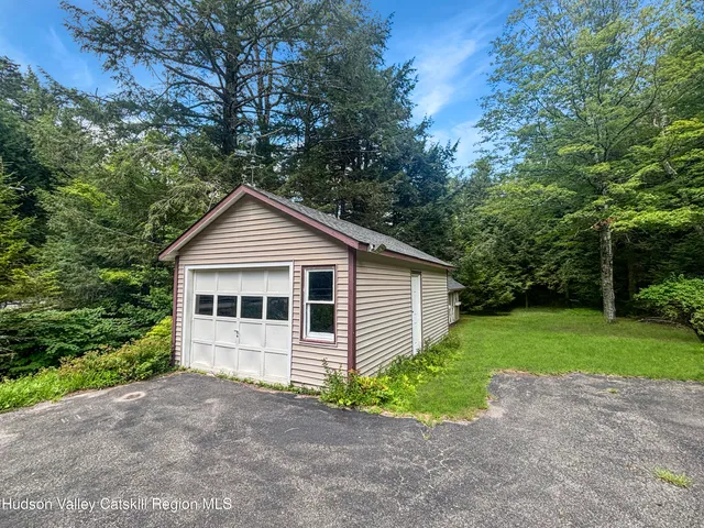 a view of a lake in between two trees
