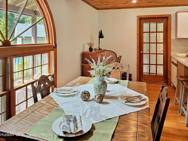 a kitchen with stainless steel appliances a sink a stove a refrigerator and cabinets