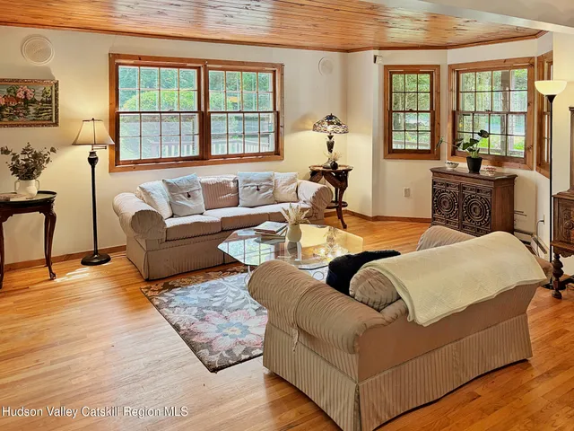 a living room with furniture and a table