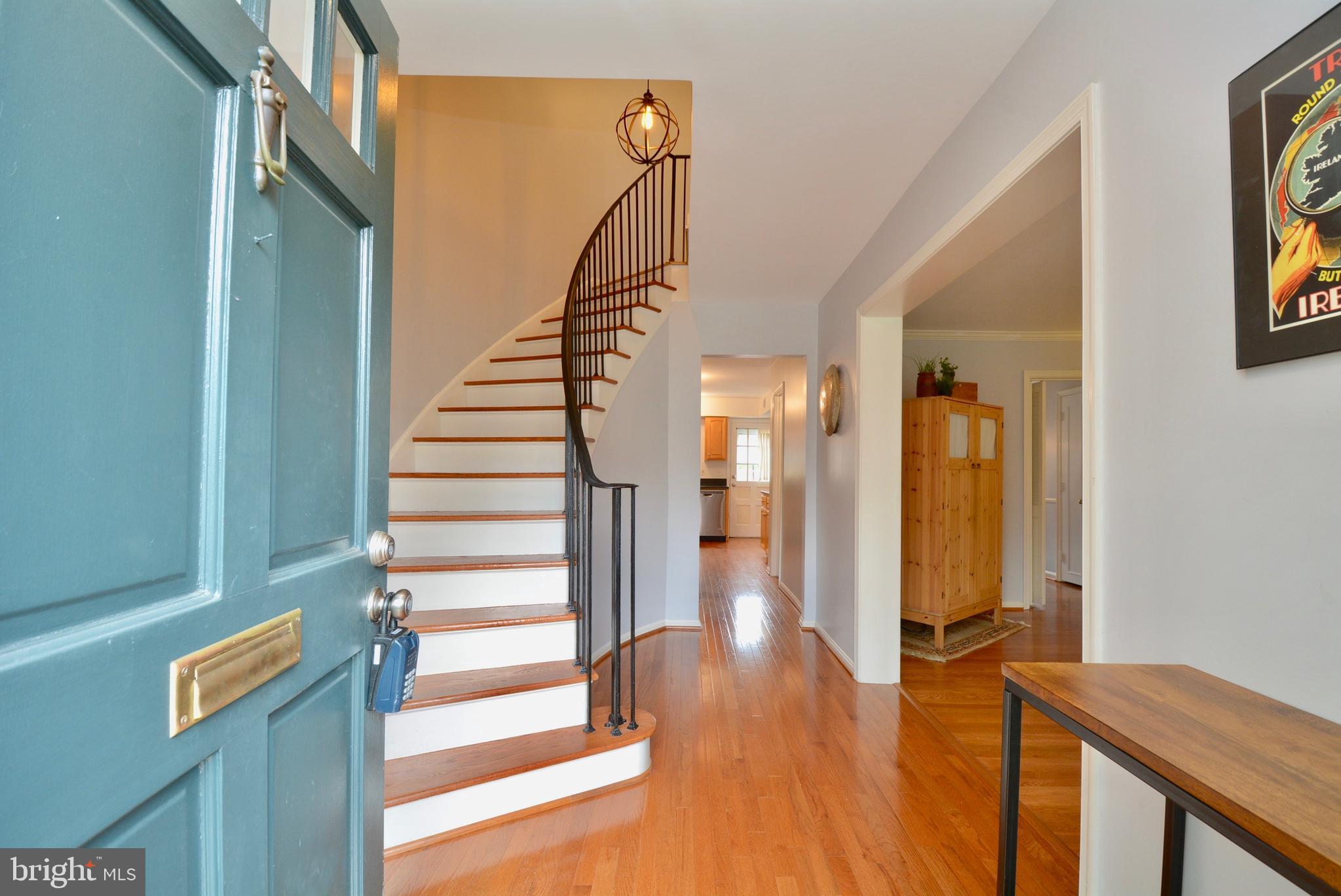 8436 Willow Forge Road Springfield, VA 22152 - Photo 3 of 39 Beautiful curved stairway greets your guest