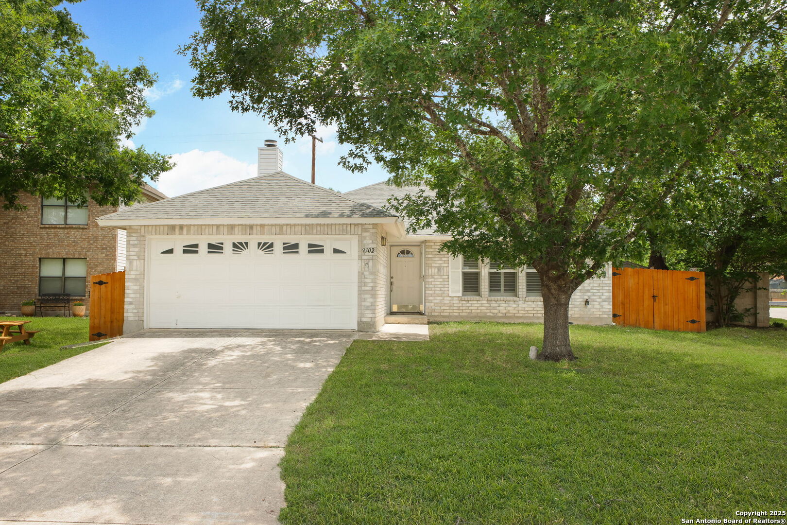 a view of a house with a house and garden