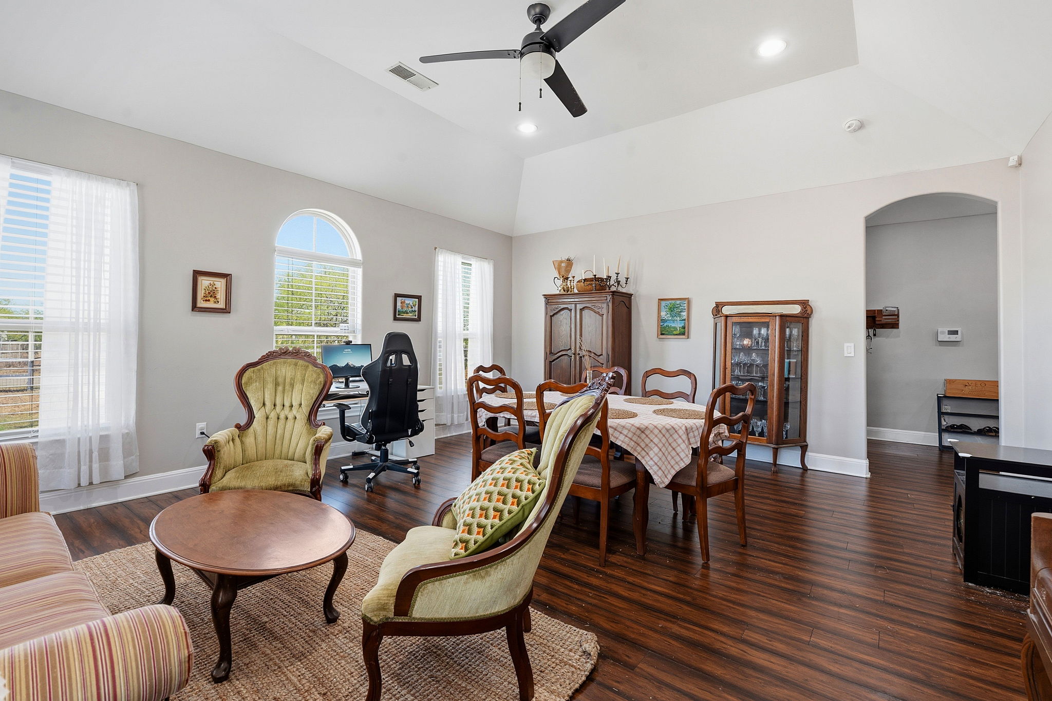 574 Highland Ranch Way Dale, TX 78616 - Photo 8 of 27 a dining room with furniture wooden floor a chandelier